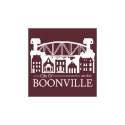 Boonville municipal emblem with a bridge and buildings on a burgundy background