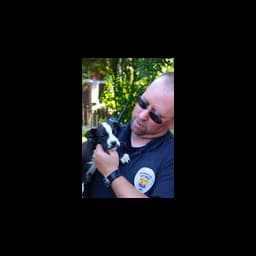 Person holding a puppy on Franklin County’s official dog-shelter page