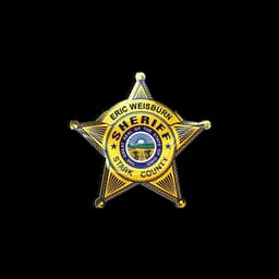 Emblema em forma de estrela do xerife de Stark County na página oficial do serviço para cães