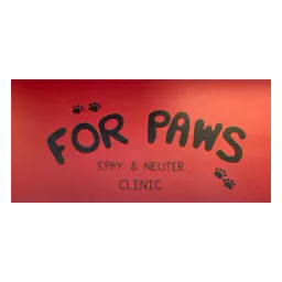 Photograph of the For Paws clinic name and paw prints painted on a red wall